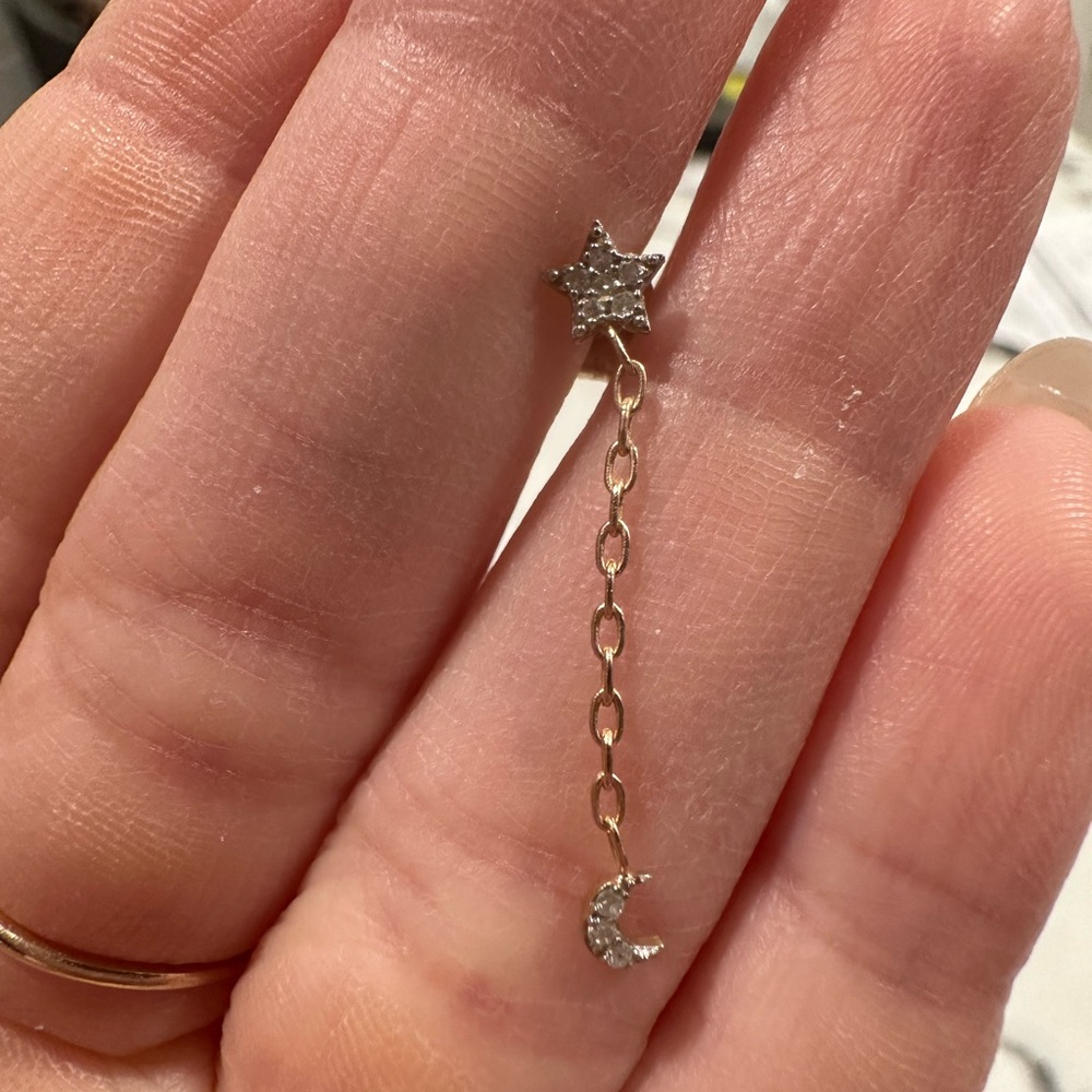 Stone and Strand 10K gold and diamond star and moon earrings.